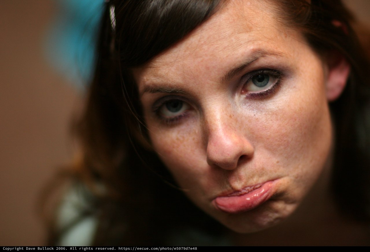 Intense Close-Up Portrait of Young Woman Pouting