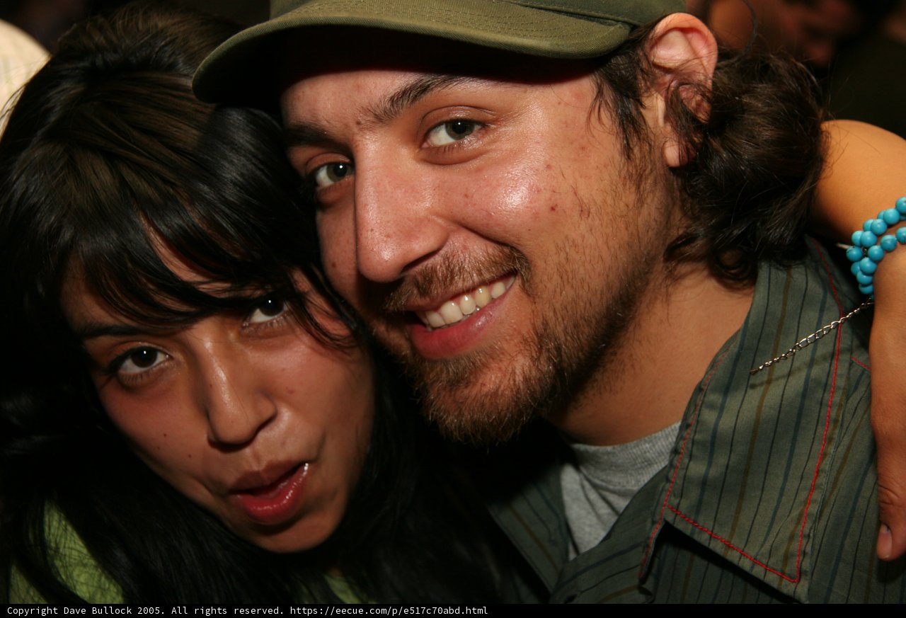 Smiling Couple in Baseball Hats