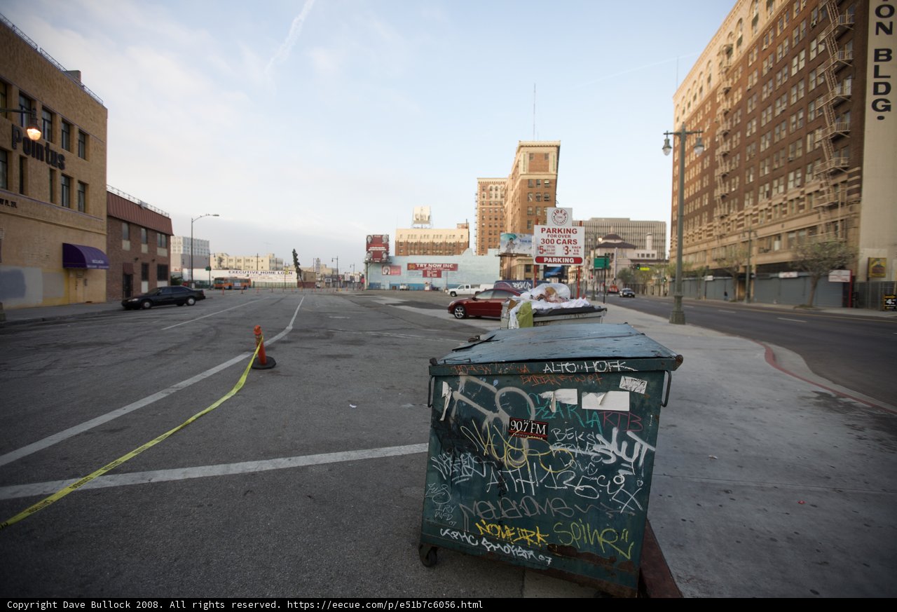 Lone Trash Can on Urban Road