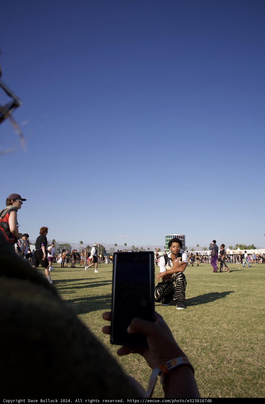 Connected Yet Alone: A Candid Moment at Coachella 2024