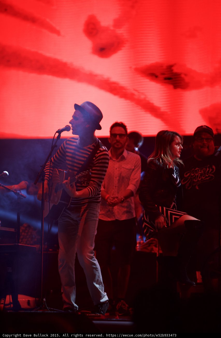 Belle and Sebastian Stuart Murdoch Full Body Profile Man White Shirt Woman Chevron Man Cap Stage