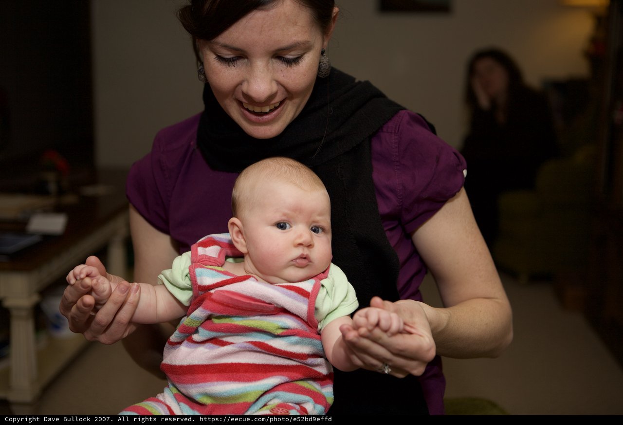 Mother and Baby Share a Joyful Moment Indoors