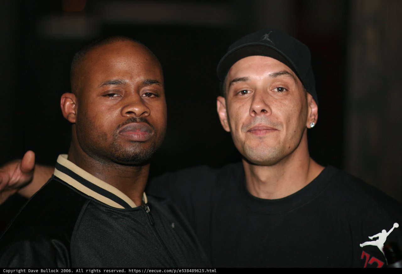 Two Men Sporting Baseball Caps