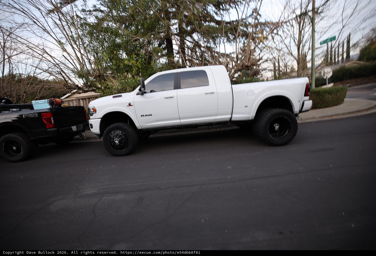 Lifted White Ram Truck on Suburban Street