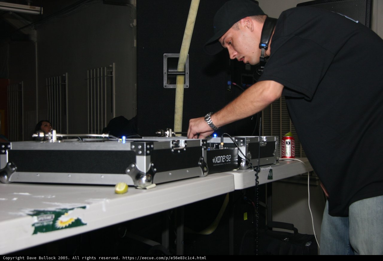DJ S wearing black shirt and baseball cap