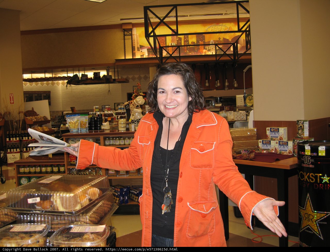 Orange Coated Woman in the Deli Section