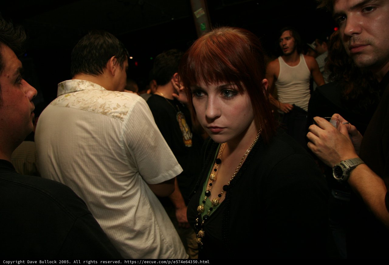 Red-Haired Woman in a Club Crowd