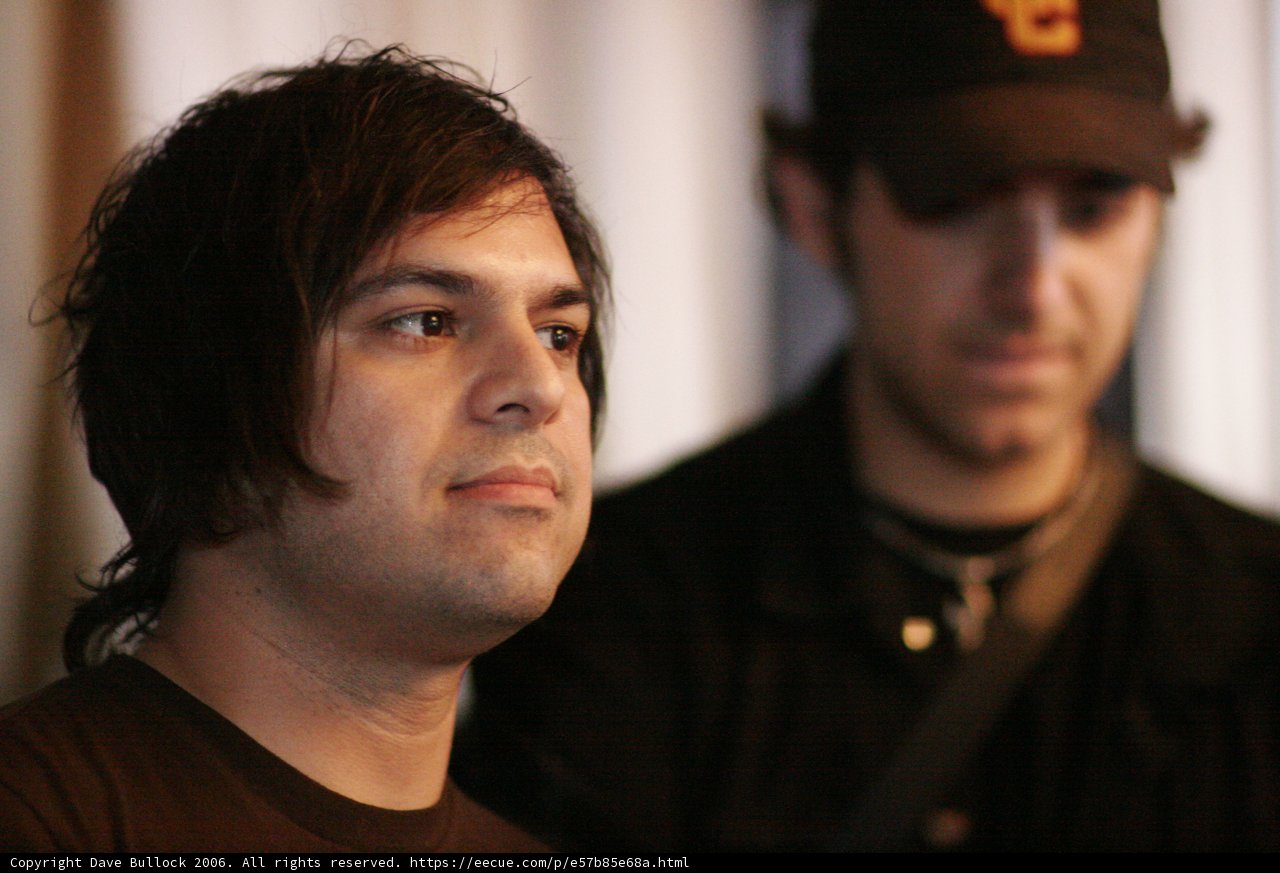 Black-Shirted Man Rocks a Baseball Cap