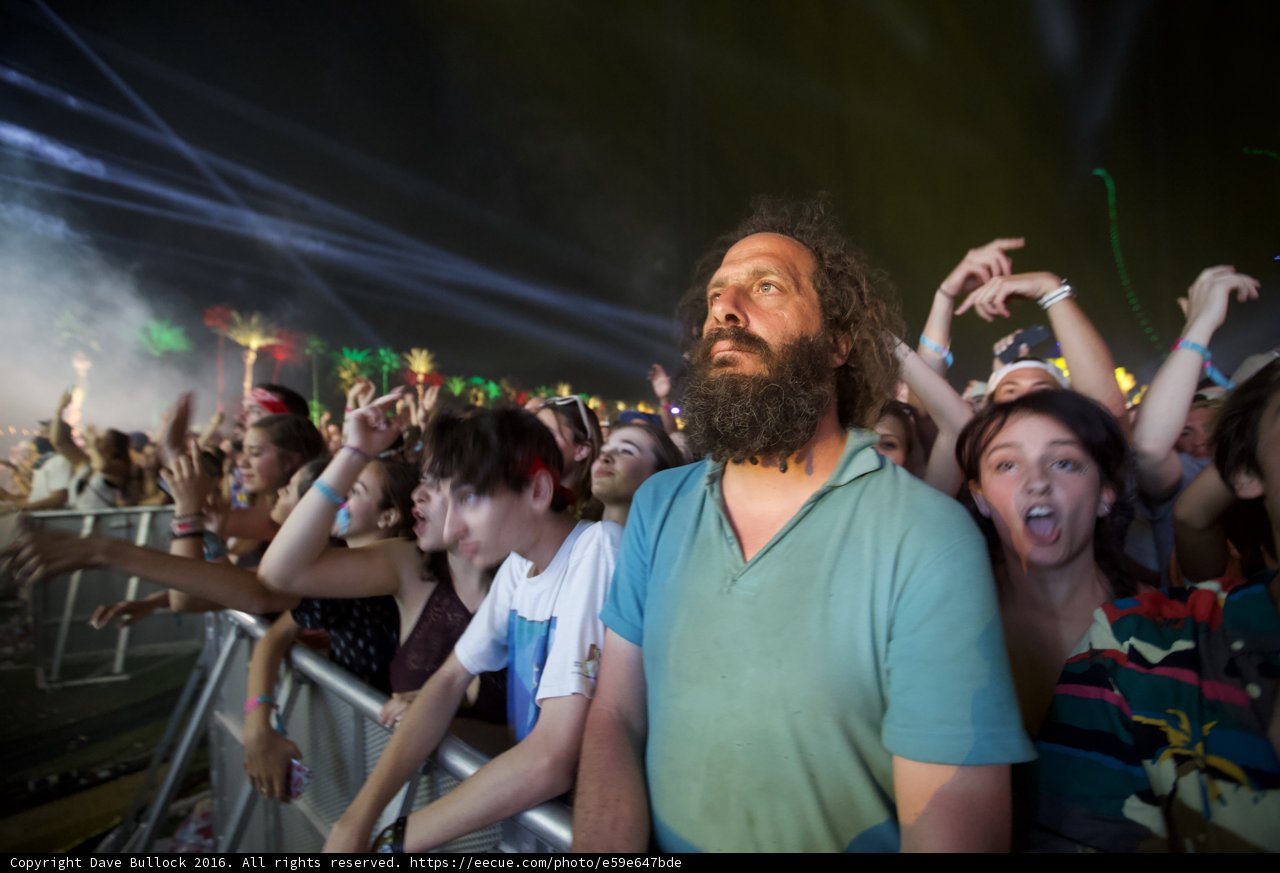 Bearded Man Commands Attention from Concert Crowd