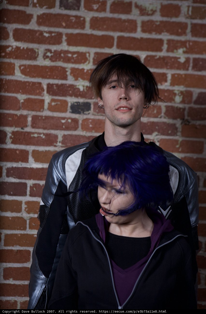 Standing Tall Against Brick Wall