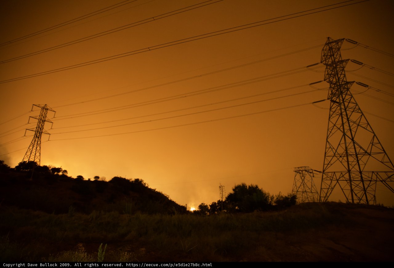 Smoky Sunset Behind Transmission Tower