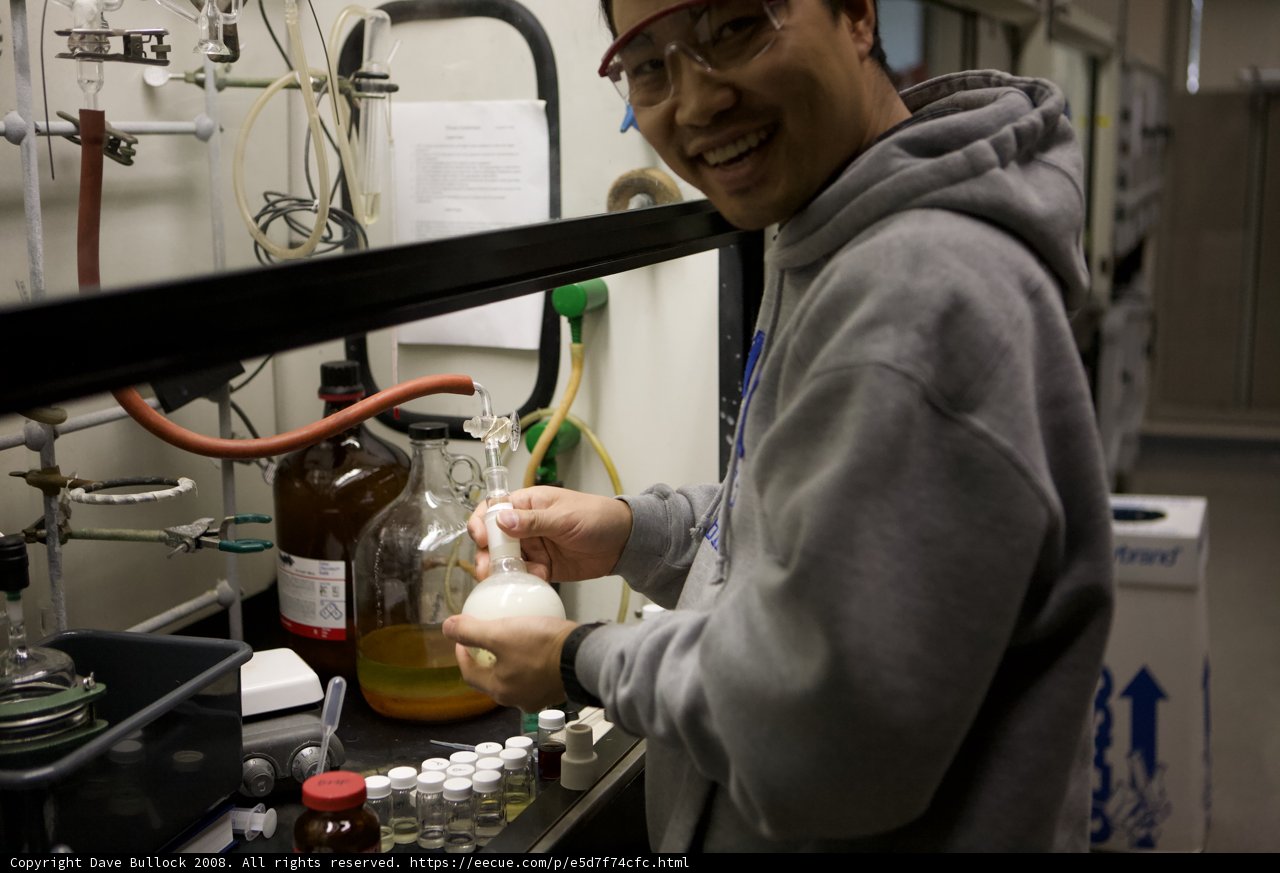 Laboratory Man with Liquid Bottle