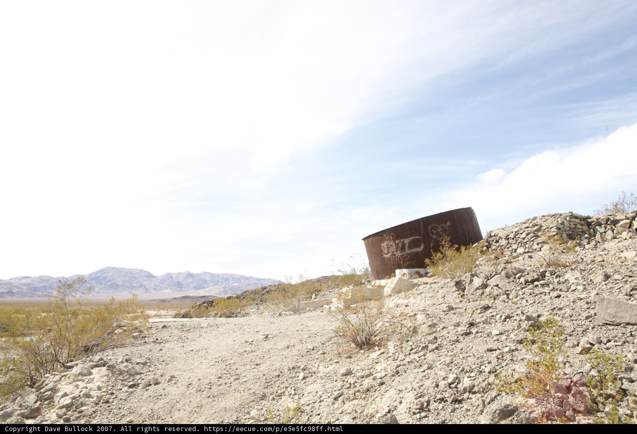 Abandoned Water Tank on a Deserted Road