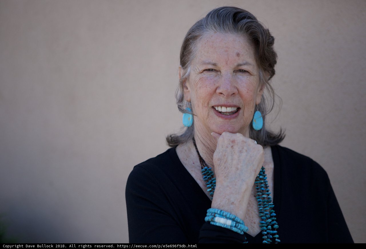 Blue Earrings and a Black Shirt
