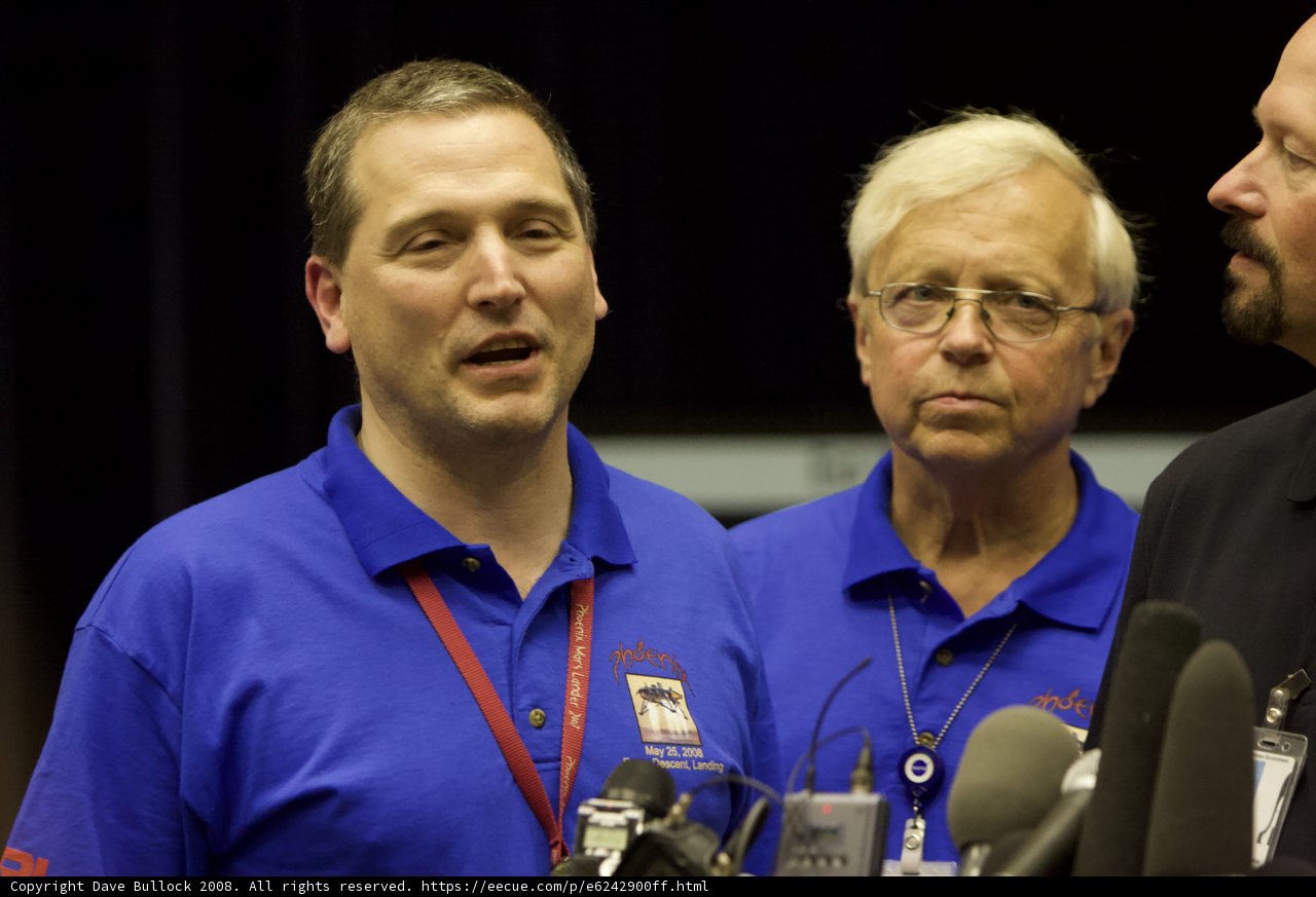 Three Men in Blue Shirts Talking at Phoenix Post Interview