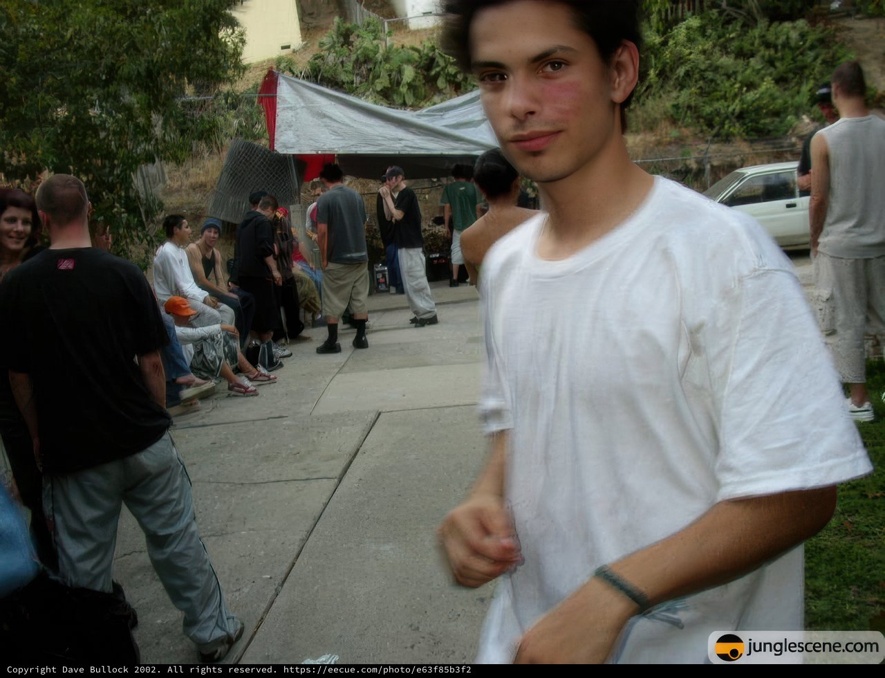Man in White Shirt Presents to the Urban Crowd
