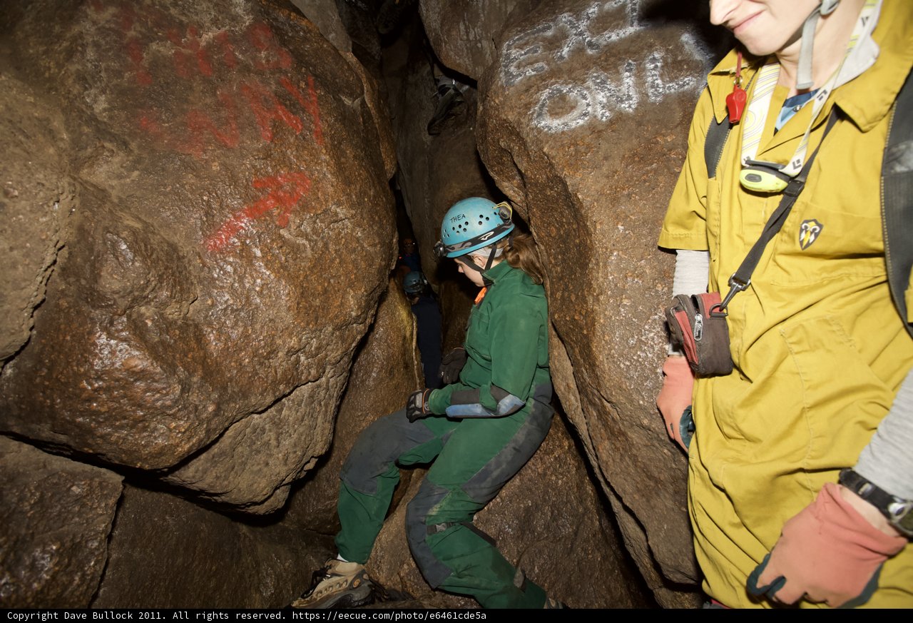 The Adventurous Man in the Green Suit Explores a Cave