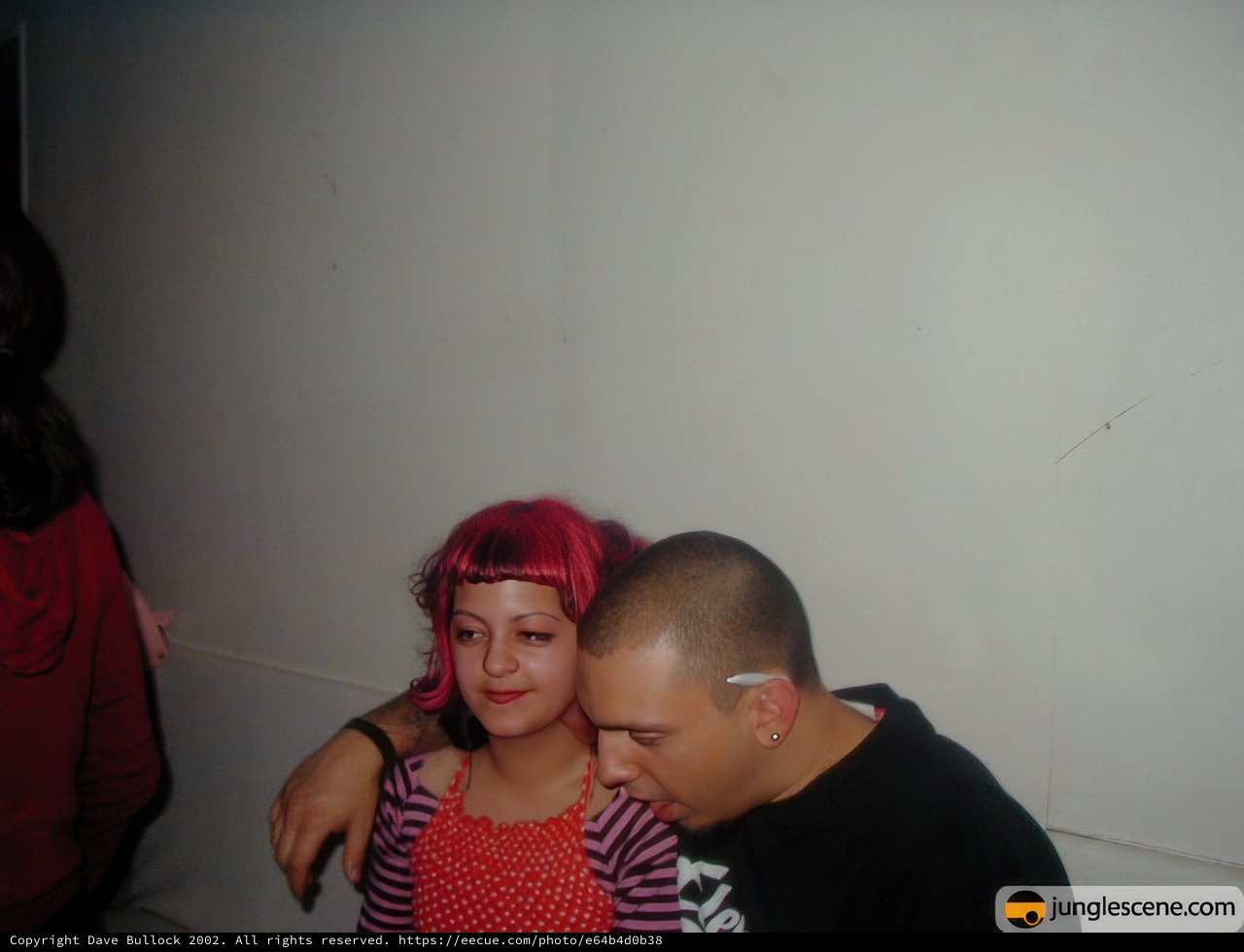 Pink-haired Couple Embrace