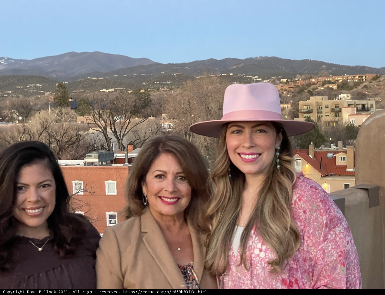 Three Women in Hats Take in the Mountain View