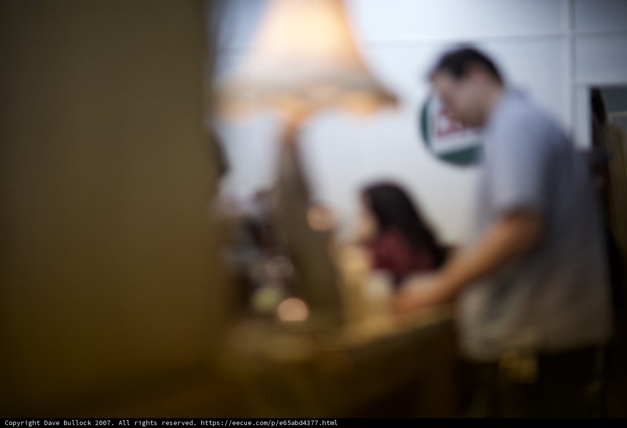 Blurred Figure in Front of the Table