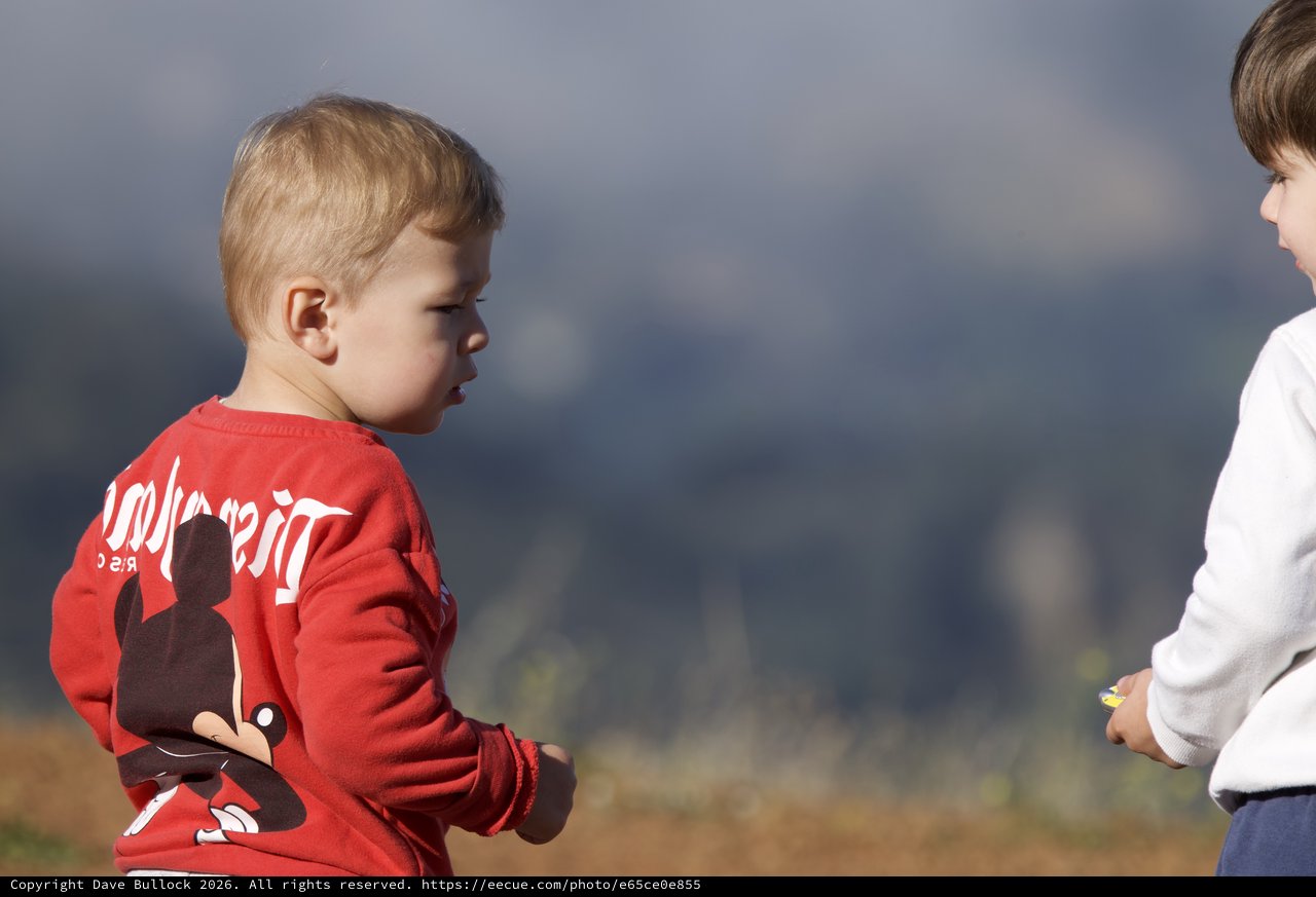 Two Young Boys Share a Tense Outdoor Moment