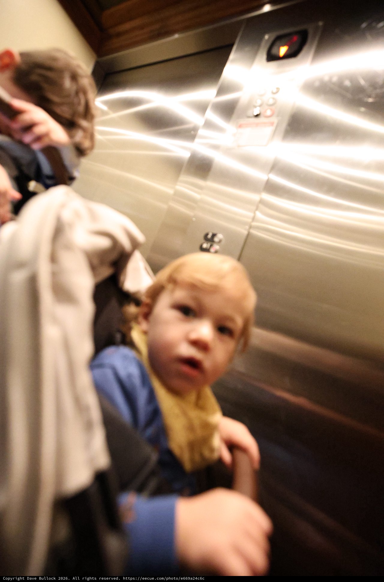 Child in Elevator with Parent - Candid Moment