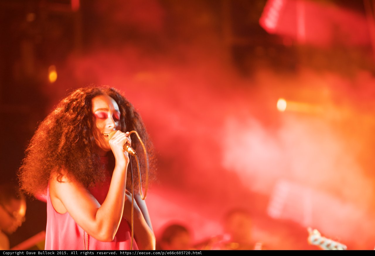 Solange Portrait Eyes Closed Guitarist Background Red Pink