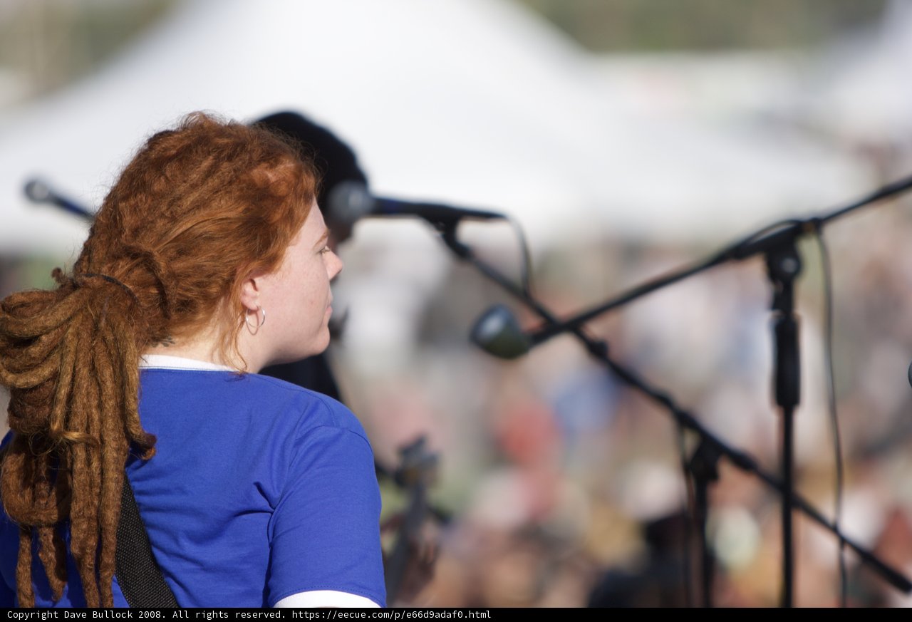 Red-Headed Dreadlocked Woman Rocks Out on Guitar at Coachella
