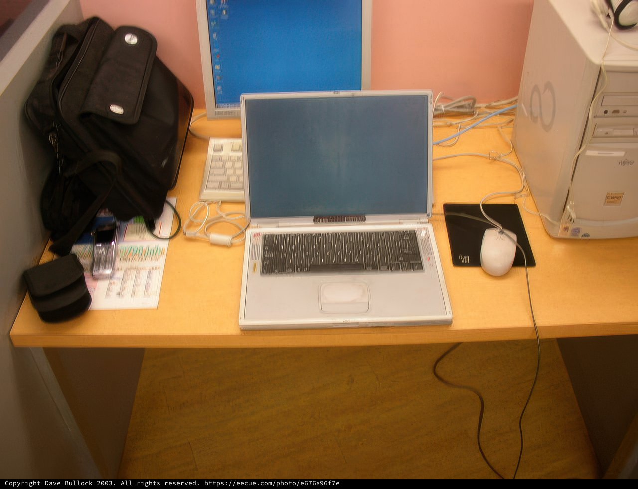 Two Laptops on a Wooden Desk