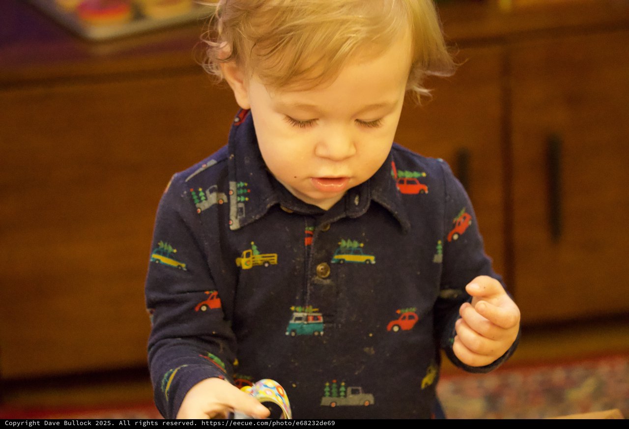 Toddler Focused on Christmas Activity in Vehicle Pajamas