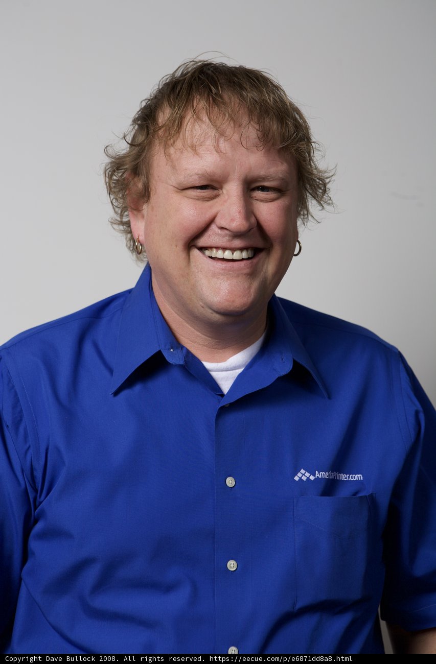 Happy man in blue shirt