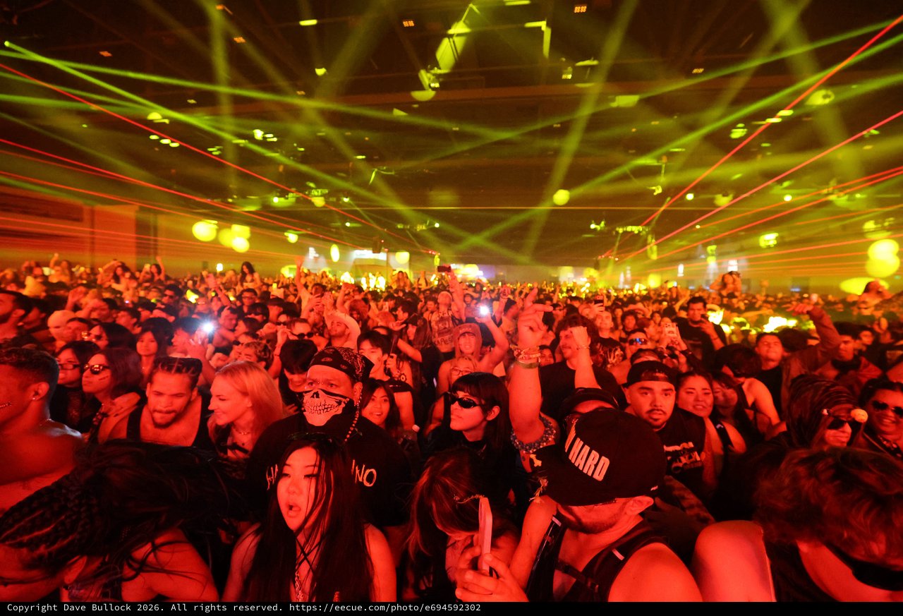 Massive Crowd Electrified Under Laser Light Show