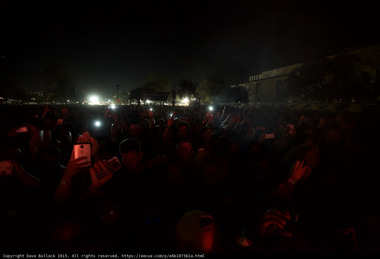 FYF Fest Crowd Red Lighting Night Phones Raised Stage Lights Building Dark Atmosphere