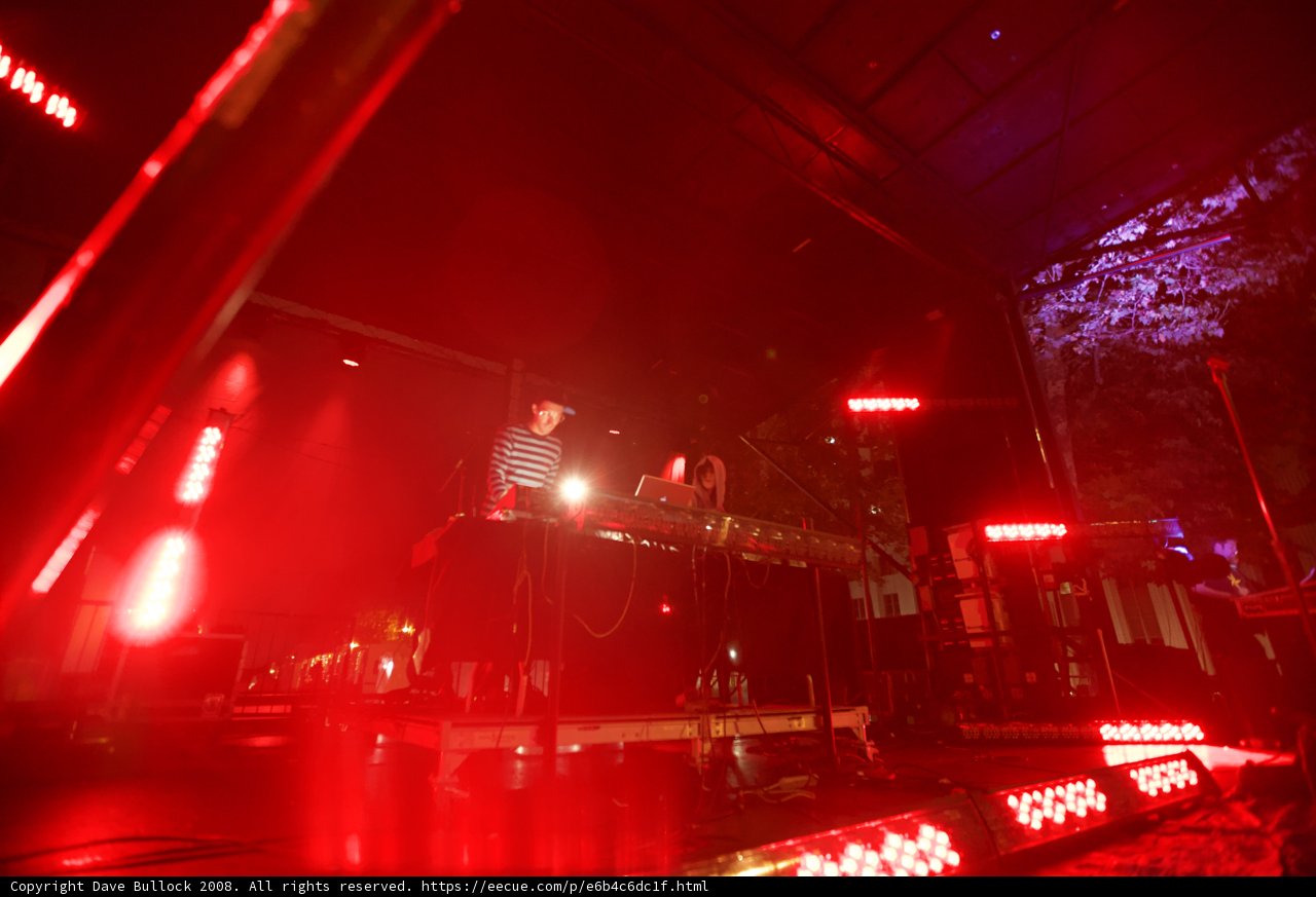 Red Spotlight on Keyboardist Rocking the Crowd