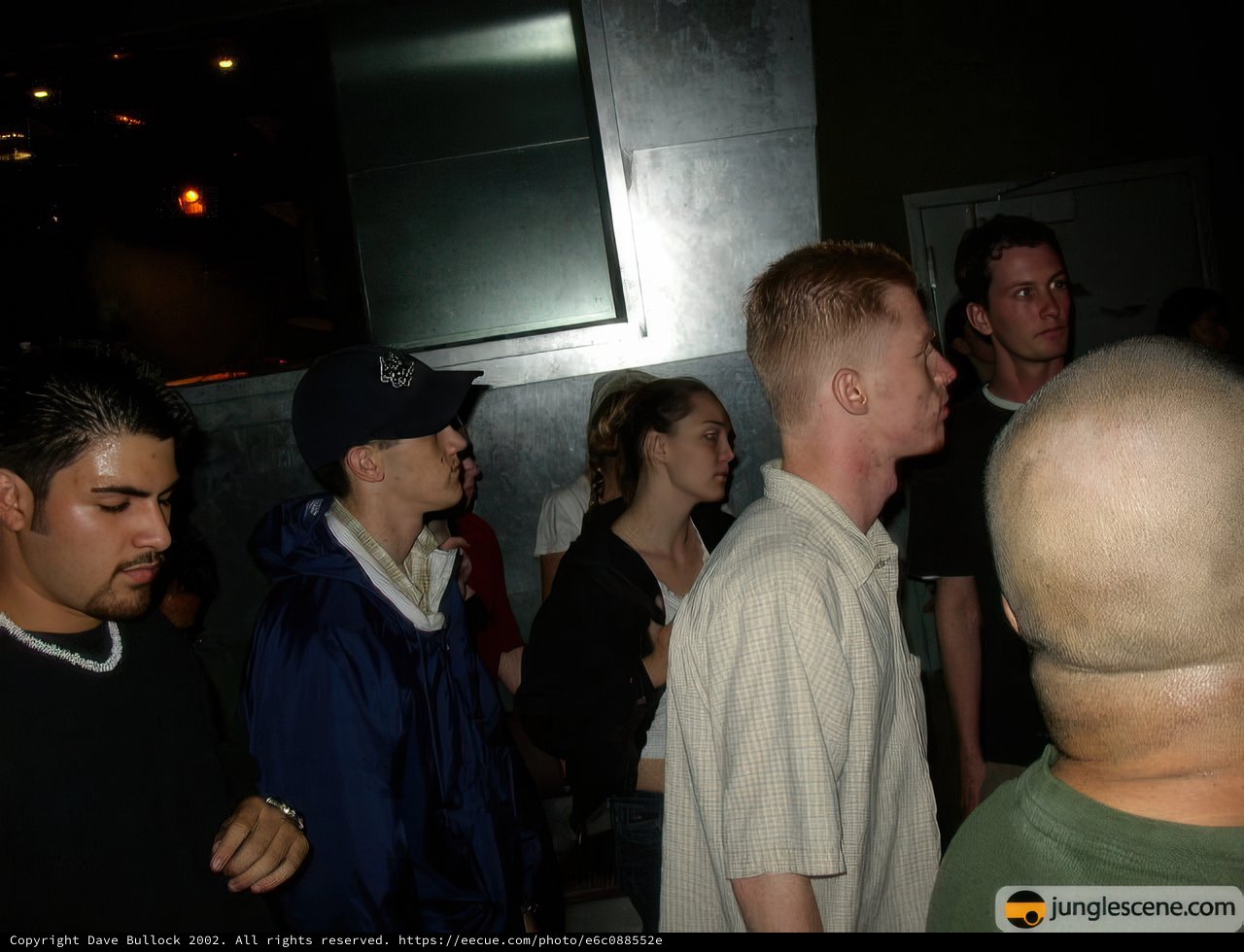 White-Shirted Man Wears Baseball Cap