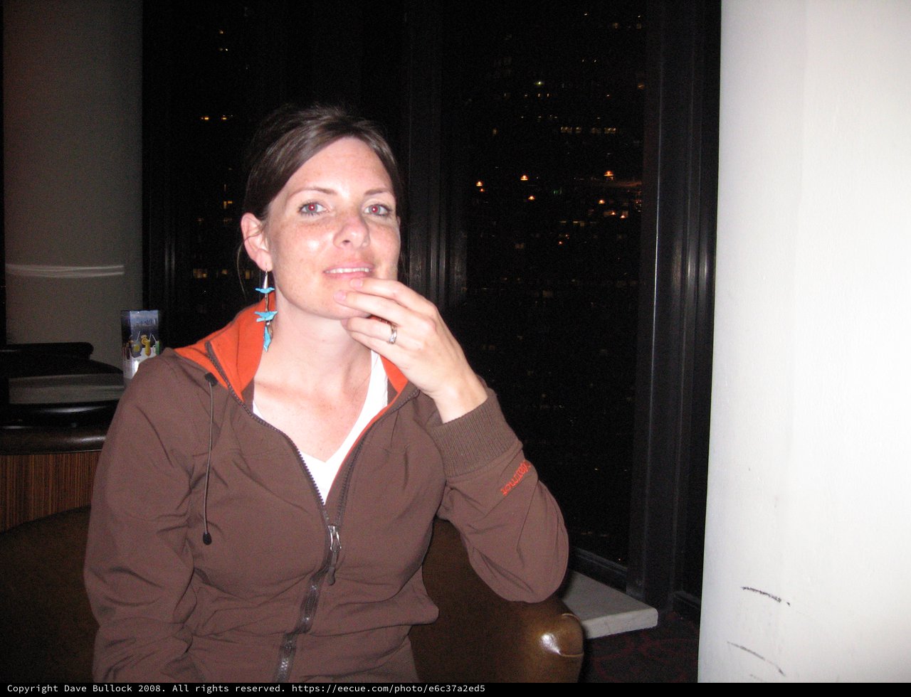 Thoughtful Woman at Night with City Views