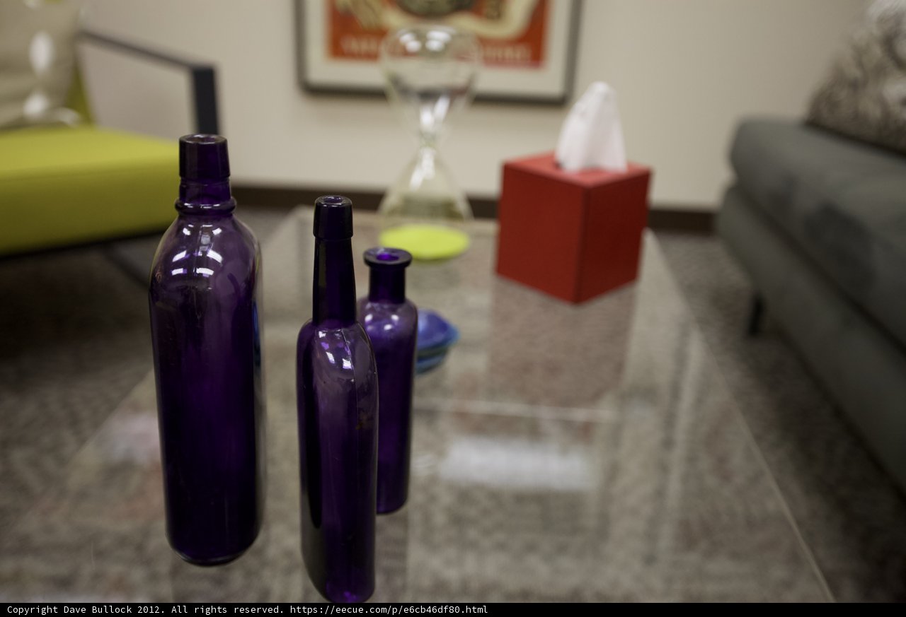 Purple Bottles on Glass Table in Living Room