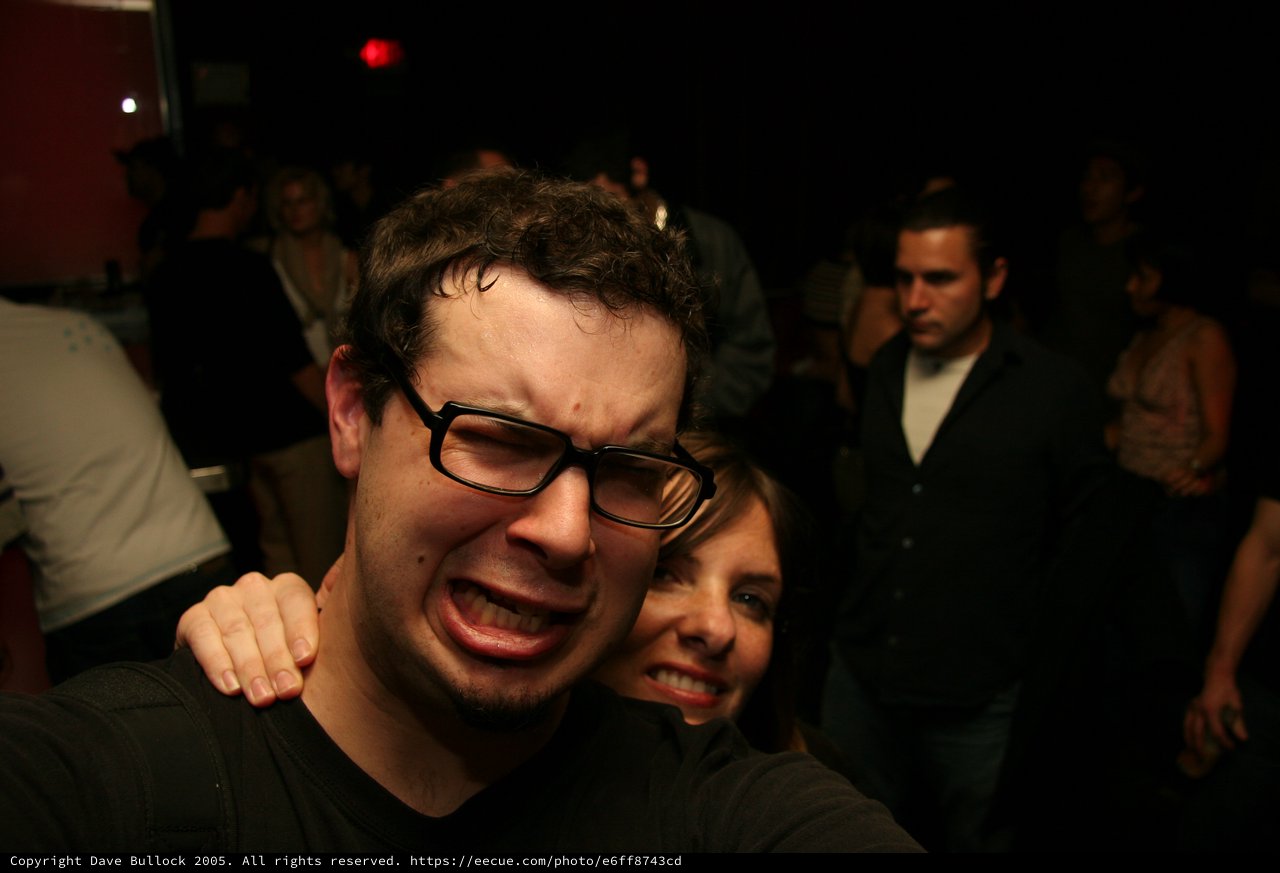 Friends Making Funny Faces at a Nightclub Party