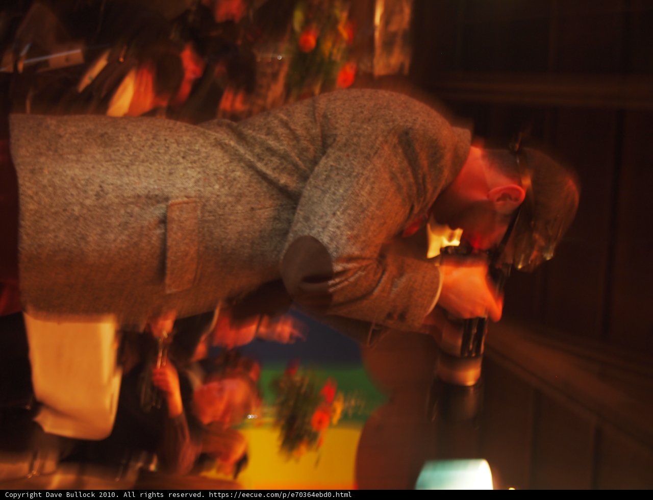 Stylish Man in Knitwear Jacket at Pub