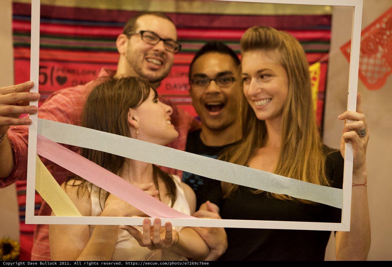 Friends Celebrate Five-Year Anniversary Behind Photo Frame