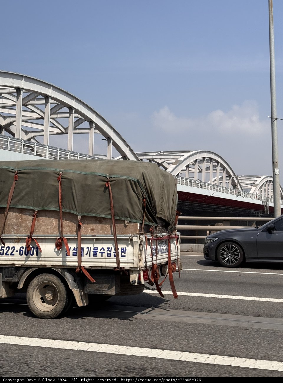 Roadside Reflection - Seoul's Urban Transport
