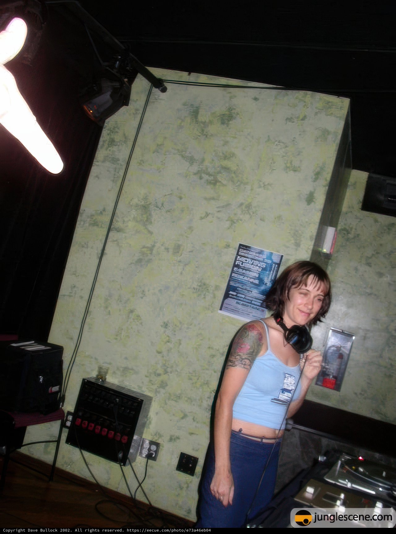Tattooed Woman Spinning with the DJ