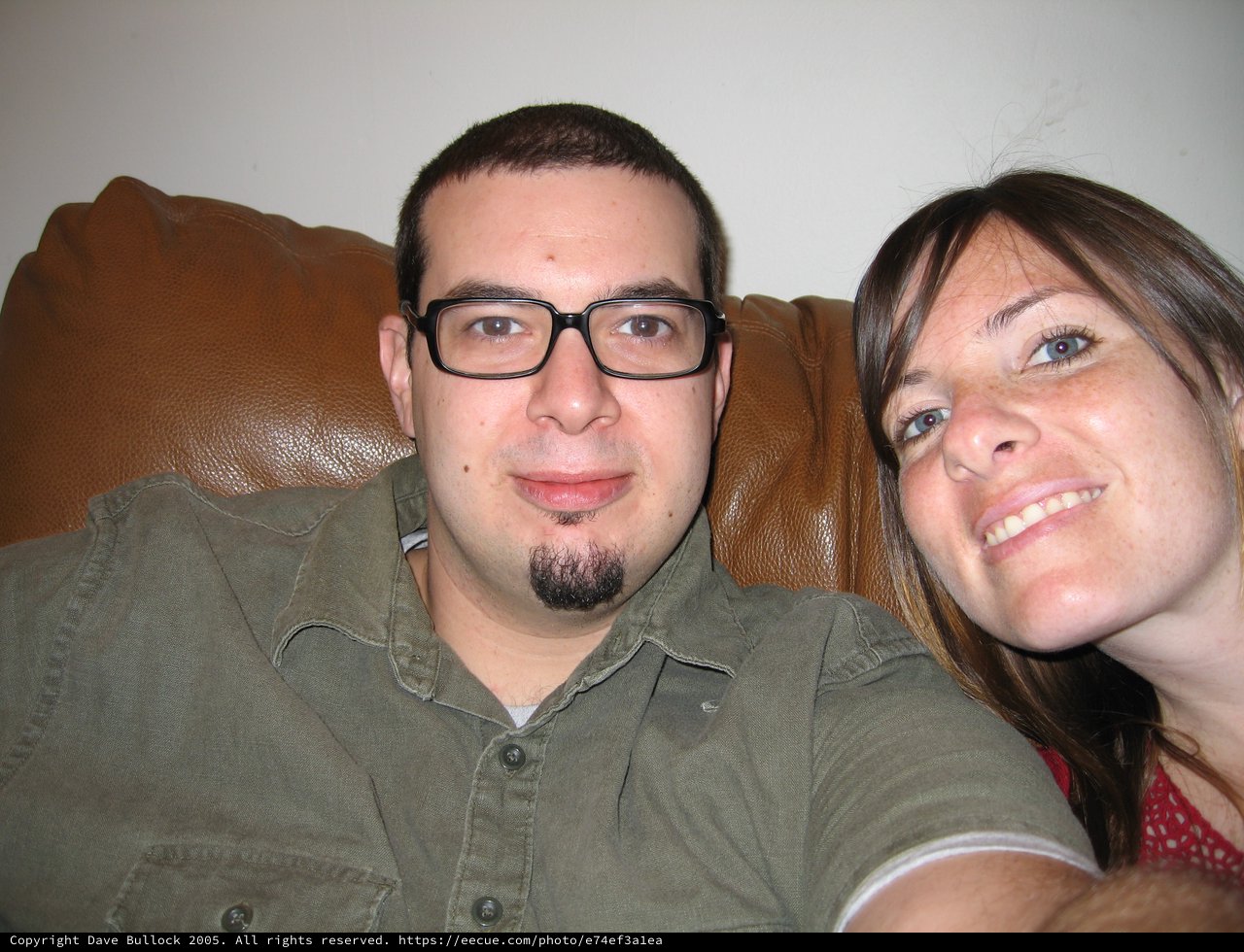 Couple Relaxing Together on Leather Couch