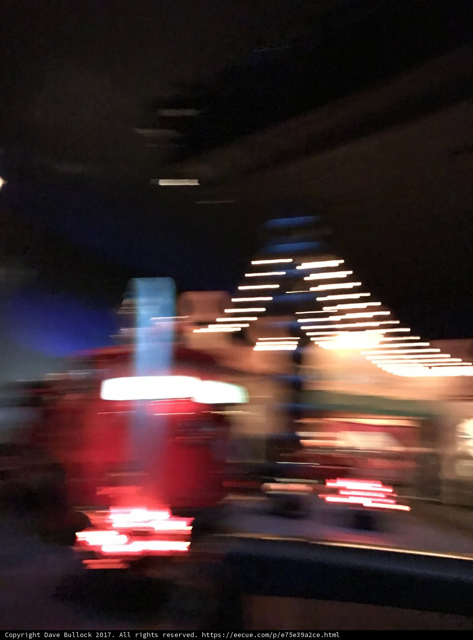 Blurry, Red Fire Truck Illuminates the Night Sky