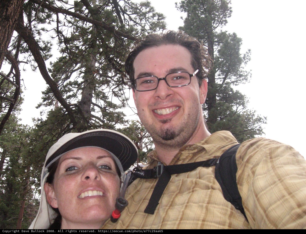 Hikers Selfie Among Pine Trees on Mountain Trail