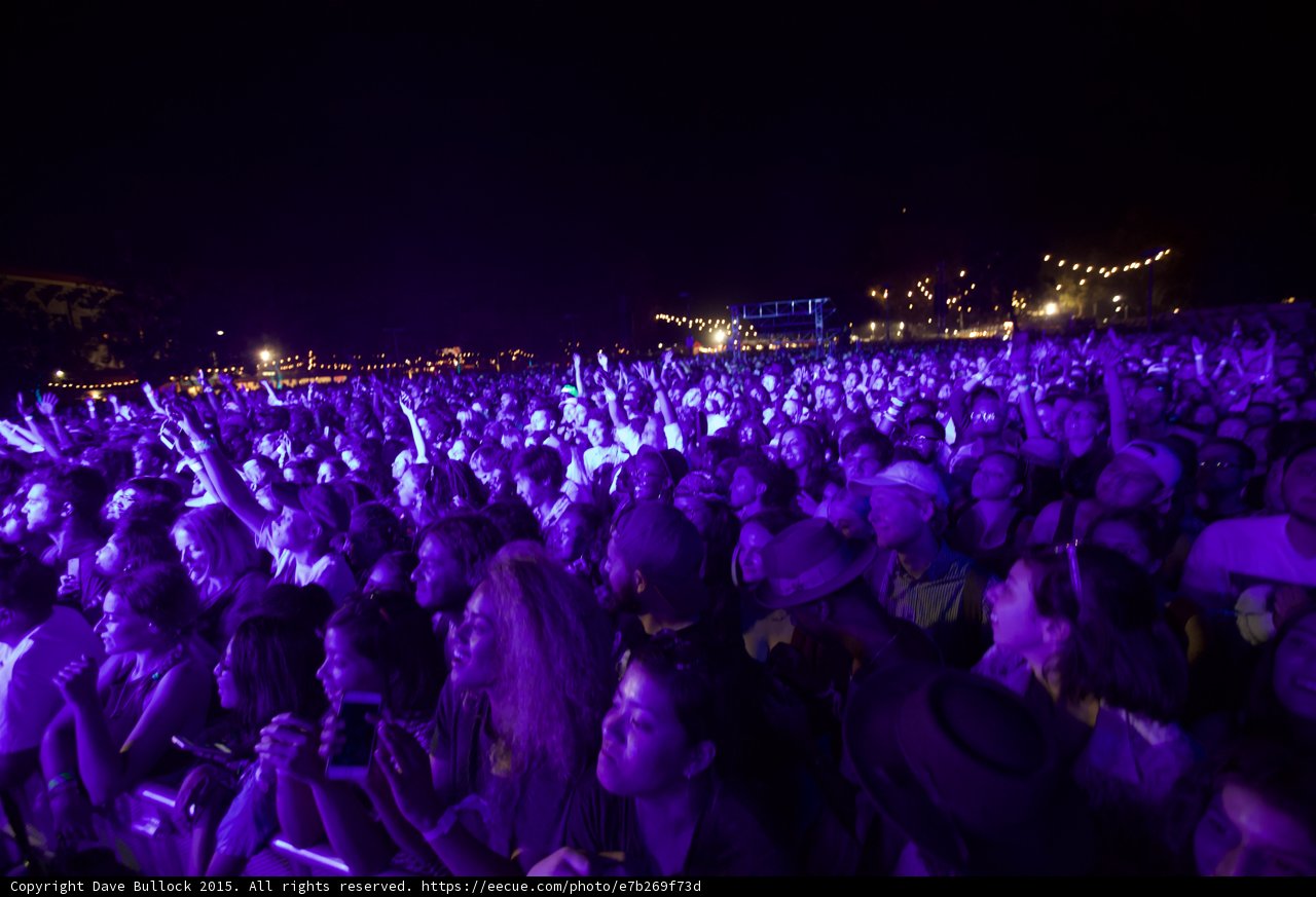 Massive Crowd Purple Light Hands Raised Stage