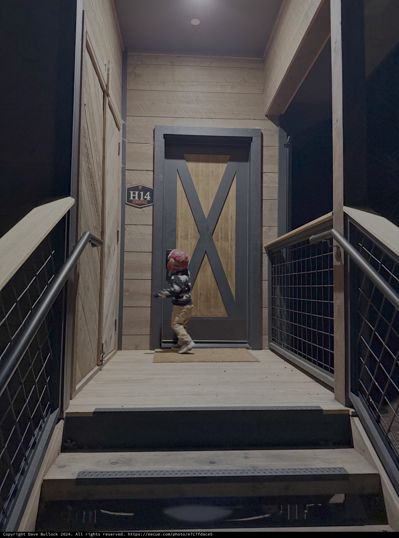 Child at Modern Barn Door Entrance