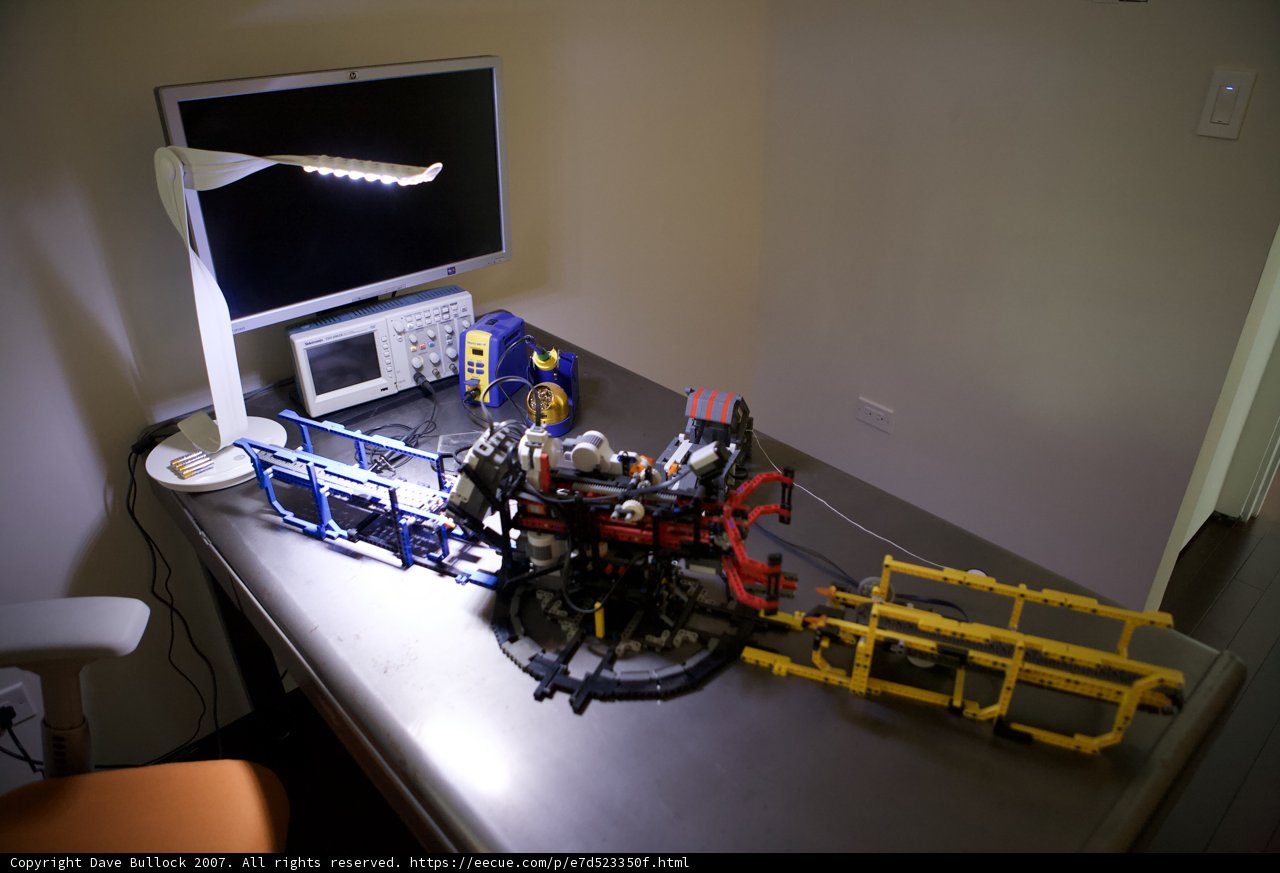 Computer and Lego Car on Table