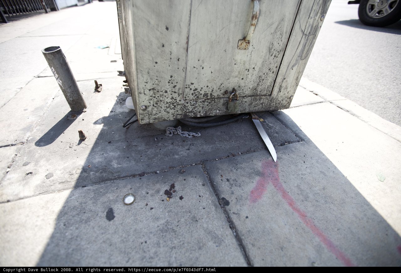 Rusty Metal Box on the Sidewalk