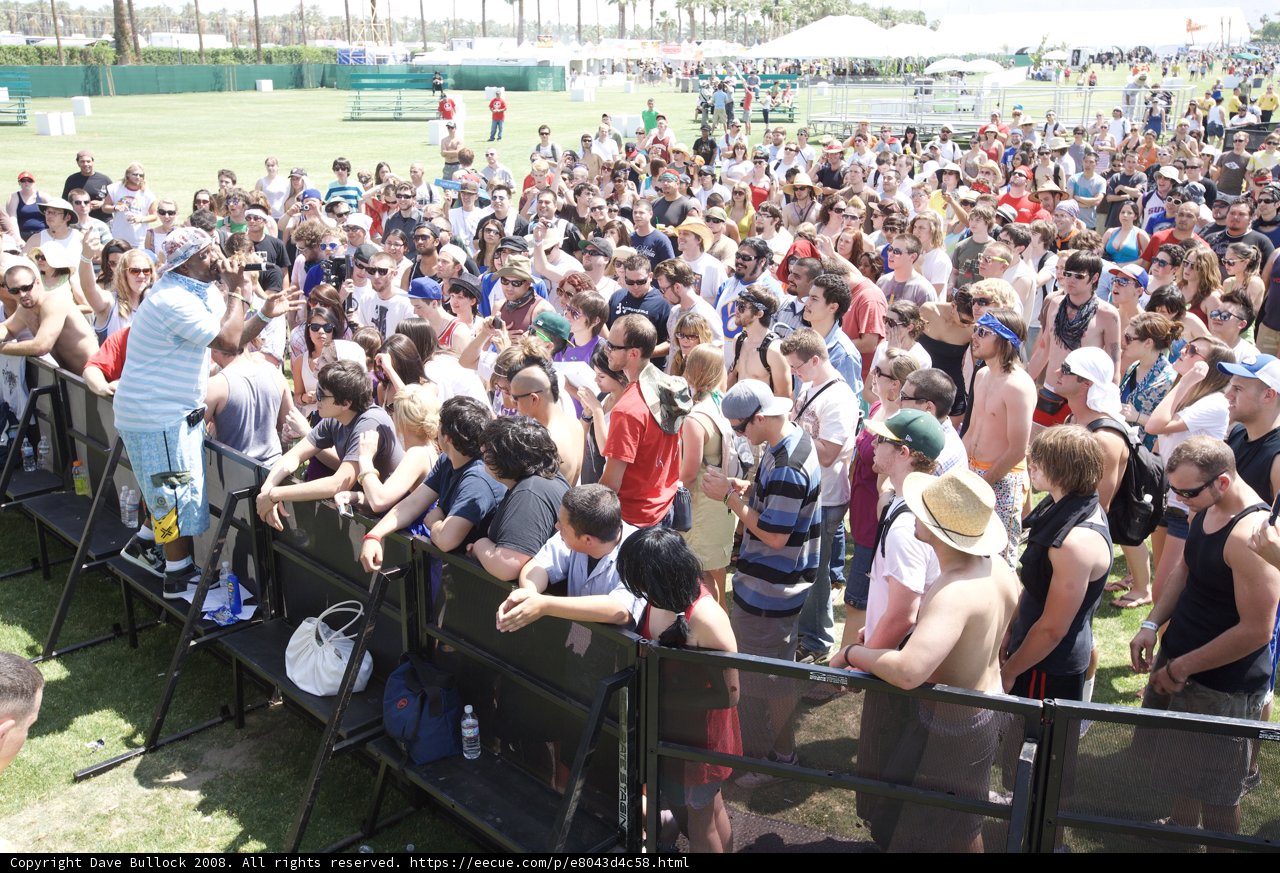 Coachella Crowd Gathers In Front of Fence